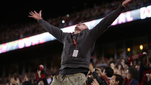 An Atlanta United fan jumps out of his seat after midfielder Yamil Asad scores the first goal in the franchise history. (Miguel Martinez / Mundo Hispanico)
