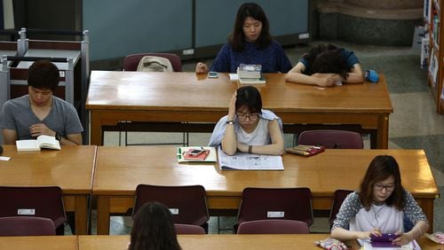 Students study at a school campus library in Seoul, South Korea