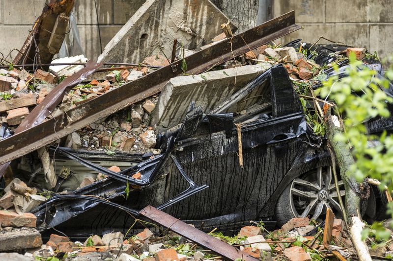 In this photo provided by the Dnipropetrovsk Regional Military Administration, a damaged car is seen at the site of a Russian attack in Dnipro, Ukraine, Friday, April 19, 2024. (Dnipropetrovsk Regional Military Administration via AP Photo)