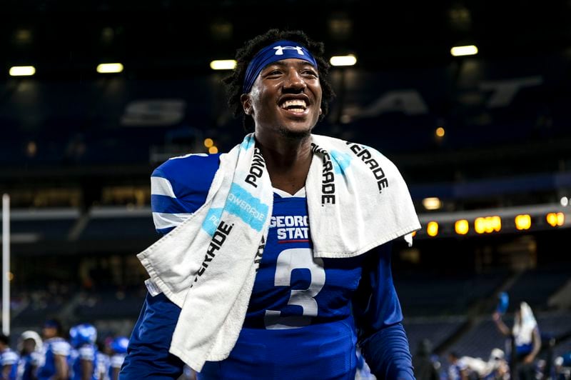 Georgia State quarterback Darren Grainger (3) is all smiles after leading the Panthers to victory over Charlotte with a final score of 20-9 Saturday, Sept. 18, 2021 at Center Parc Stadium in Atlanta. (Daniel Varnado/For the AJC)