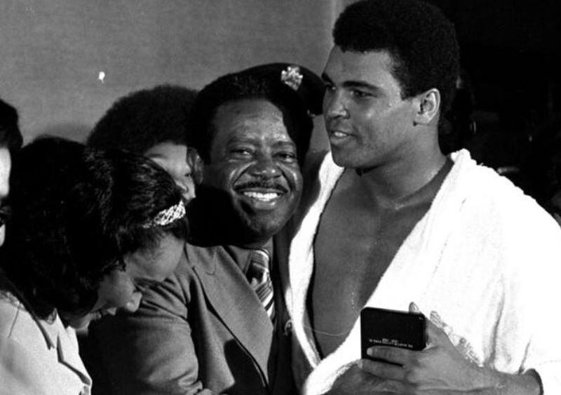 Muhammad Ali is congratulated by Dr. Ralph Abernathy and Coretta Scott King after beating Jerry Quarry in Atlanta on Oct. 26, 1970. AP/file photo