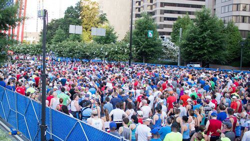 People line up to run in the annual AJC Peachtree Road Race on Wednesday, July 4, 2018. Jenna Eason / Jenna.Eason@coxinc.com
