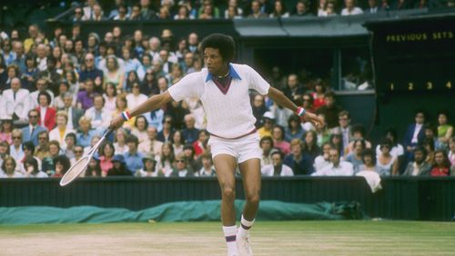 Arthur Ashe runs for the ball during a match at Wimbledon in England. (Tony Duffy/Getty Images)
