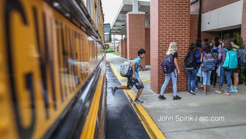 August 7, 2017 Lithonia; Fifth grade student Isaiah Brown, 10, enjoys the freedom of an open hallway as he is the first student to arrive for the first day of school at Edward L Bouie Elementary School on Monday, August 7, 2017, in Lithonia. Curtis Compton/ccompton@ajc.com