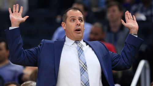 Orlando Magic head coach Frank Vogel signals to a player during the first half of an NBA basketball game against the Brooklyn Nets in Orlando, Fla., on Friday, Dec. 16, 2016. (AP Photo/Reinhold Matay)
