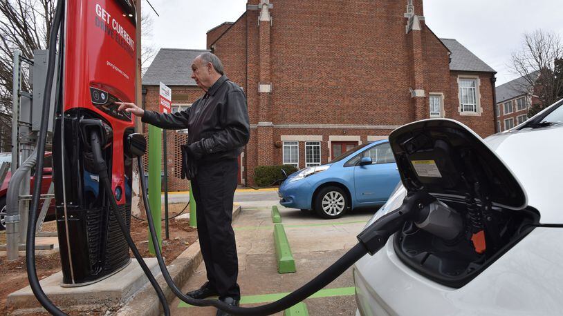 Don Francis, executive director of Clean Cities Georgia, charges his electric vehicle using DC Fast Charging station at Agnes Scott College, in this file photo from January 2016. Francis is hoping lawmakers will take another look at incentives for electric cars, perhaps with a break on sales tax. HYOSUB SHIN / HSHIN@AJC.COM