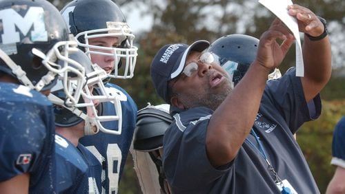 051108 MARIETTA, GA (COBB):  Marietta High School head football coach head football coach James "Friday" Richards <cq> is shown in a Tuesday 11/8/05 photo as he leads a practice at the school as the Blue Devils prepare for their Friday night playoff game against Brookwood High School in Gwinnett County.   This goes with a story advancing the game.  PHOTO BY ANDY SHARP/STAFF.