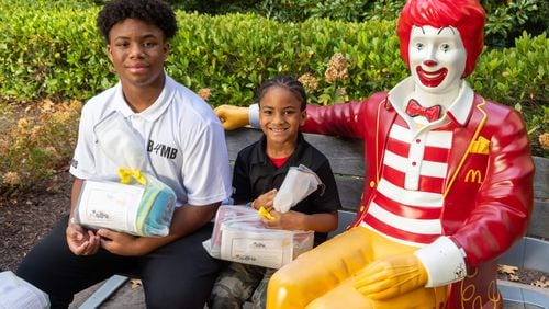 C.J. Matthews (left), age 16 and his brother Kollin, 7, prepare to make a delivery to the Ronald McDonald House as part of their Blankies 4 My Buddies nonprofit. PHIL SKINNER FOR THE ATLANTA JOURNAL-CONSTITUTION