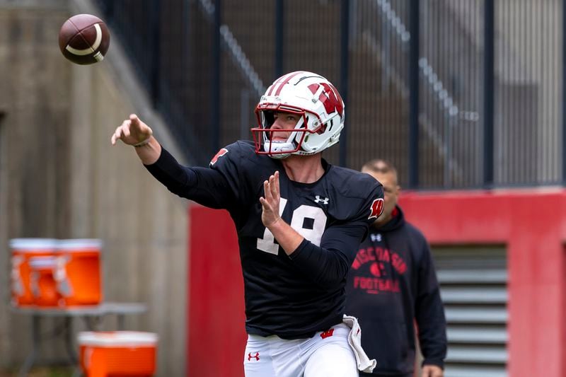 Wisconsin quarterback Braedyn Locke (18) makes a pass during spring NCAA college football practice on a field outside Camp Randall Stadium in Madison, Wis., Saturday, April 20, 2024. (Samantha Madar/Wisconsin State Journal via AP)