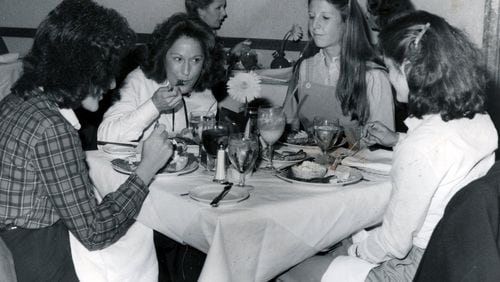 The Magnolia Room was a dining destination in the old downtown Rich’s department store. Shown dining in October of 1982 are Nancy Richter (left to right), Debbie Morse, Terry Allen and Neil Bell. AJC file