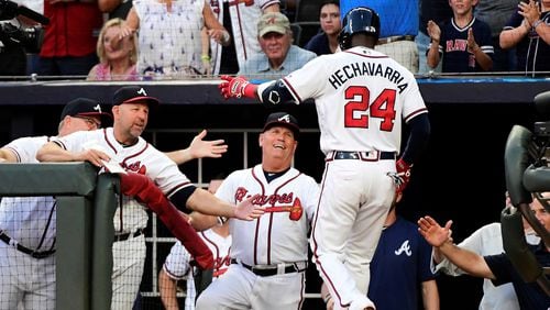 Adeiny Hechavarria  of the Atlanta Braves celebrates hitting a 2-run home run in the second inning against the Miami Marlins at SunTrust Park on August 21, 2019 in Atlanta, Georgia. (Photo by Logan Riely/Getty Images)