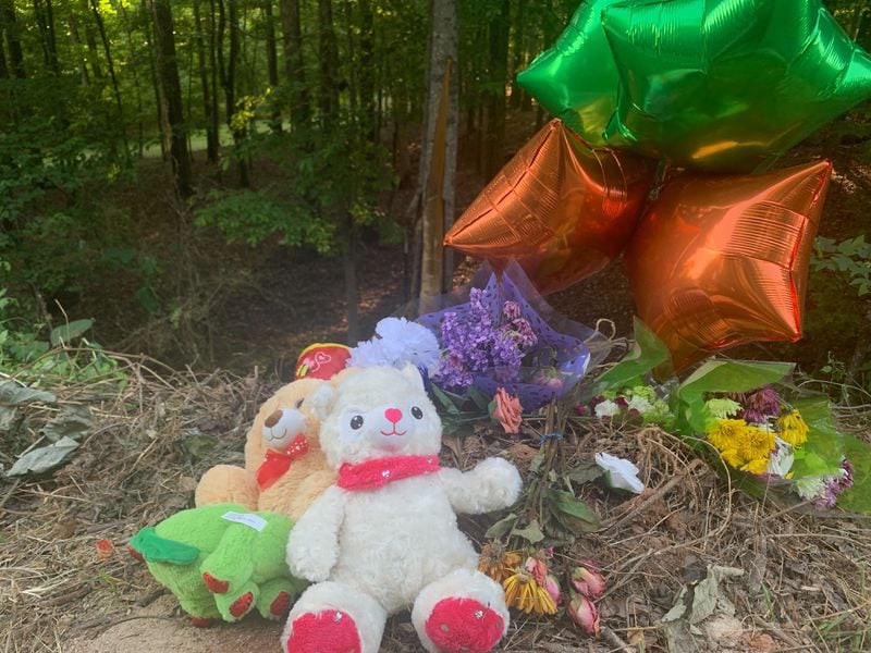 A memorial was growing Monday along Oak Grove Road where the car went off the road.