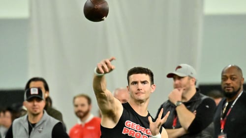 Stetson Bennett throws a football during Georgia’s Pro Day in the Payne Indoor Athletic Facility, Wednesday, March 15, 2023, in Athens, GA. (Hyosub Shin / Hyosub.Shin@ajc.com)