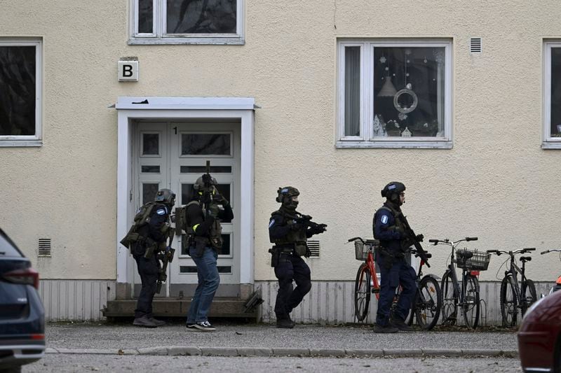 Police officers at the scene of Viertola comprehensive school, in Vantaa, Finland, Tuesday, April 2, 2024. Finnish police say a number of people were wounded in a shooting at a school outside Helsinki and a suspect was detained. (Markku Ulander/Lehtikuva via AP)