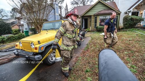 DeKalb County crews responding to a condo fire on Park Gate Place outside the city of Stone Mountain on Friday morning learned a woman was trapped inside.