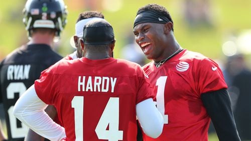 July 27, 2017 Flowery Branch: Falcons wide receivers Julio Jones and Justin Hardy share a laugh during the first day of team practice at training camp on Thursday, July 27, 2017, in Flowery Branch. Curtis Compton/ccompton@ajc.com