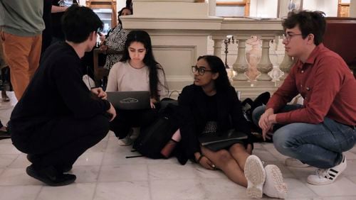 Student members of the Georgia Youth Justice Coalition have a late night at the Capitol awaiting a vote on the voucher bill on the Legislature's final day. From left, Mason Goodwin, Isabelle Philip, Zeena Mohamed and Hampton Barrineau.