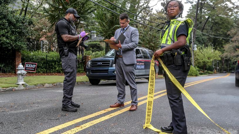 A man who was found shot multiple times and killed Thursday morning, Oct. 13, 2022 in the driveway of a Buckhead home. The victim was spotted shortly before 8 a.m. in the 1200 block of Peachtree Battle Avenue. (John Spink / John.Spink@ajc.com)