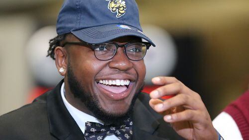 020216 ATLANTA: Grayson High School defensive tackle Chris Martin is all smiles sporting his Georgia Tech hat and bow tie during national signing day at the College Football Hall of Fame on Wednesday, Feb, 3, 2016, in Atlanta. Curtis Compton / ccompton@ajc.com