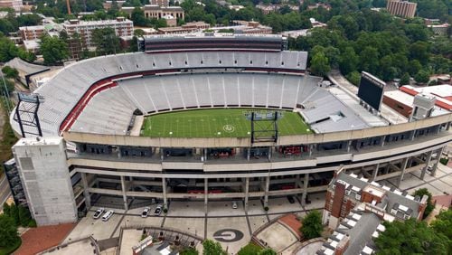 Aerial view of Sanford Stadium in Athens. With a $25 million expansion completed in 2003 and $8 million more in 2004, the University of Georgia added a second upper deck on the north side and 27 new north side SkySuites bringing the new stadium capacity to 92,746 — the fifth largest on-campus stadium in the country. UGA’s athletic department simply is committed to too many other facility projects that have precedence at the moment. Most notable is the $80 million football operations building that has been added to the Butts-Mehre complex. (Hyosub Shin / Hyosub.Shin@ajc.com)