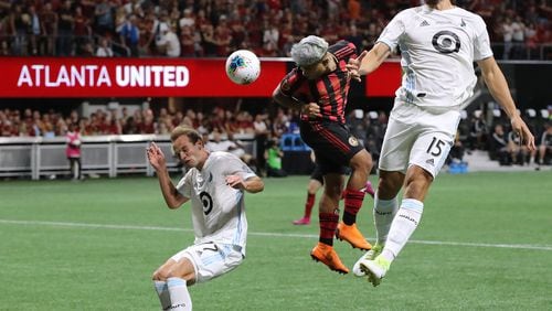 August 27, 2019 Atlanta: Atlanta United forward Josef Martinez misses a header in front of the goal as Minnesota United defenders Chase Gasper (left) and Michael Boxall (right) attempt to block the shot during a 2-1 Atlanta United victory in the U.S. Open Cup on Tuesday, August 27, 2019, in Atlanta.  Curtis Compton/ccompton@ajc.com