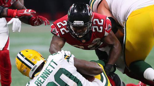 September 17, 2017 Atlanta: Falcons safety Keanu Neal body slams Packers tight end Martellus Bennett for the stop during the second half in a NFL football game on Sunday, September 17, 2017, in Atlanta.    Curtis Compton/ccompton@ajc.com