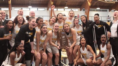 The Oglethorpe women's basketball team after winning the Southern Athletic Association tournament championship March 1 at Oglethorpe's Dorough Field House. The university announced on July 16, 2020 that its fall sports schedule has been postponed and some spring programs, such as basketball, will be altered by the decision. (Photo courtesy Savannah LeGate)