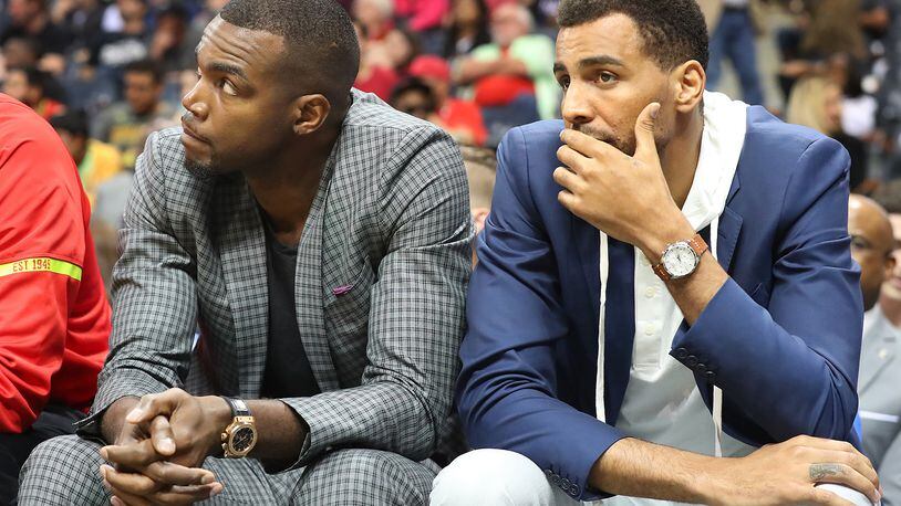 Injured Atlanta Hawks forwards Paul Millsap (left) and Thabo Sefolosha watch from the bench as the Hawks fall 107-92 to the Brooklyn Nets in a NBA basketball game on Sunday, March 26, 2017, in Atlanta. It is the Hawks seventh consecutive loss and the fifth consecutive game Paul Millsap has missed. Curtis Compton/ccompton@ajc.com