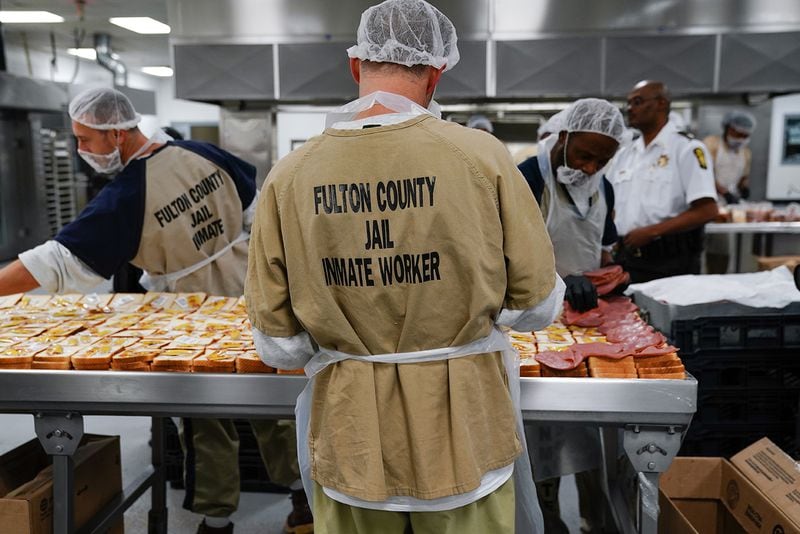 Inmates are seen preparing sandwiches for lunch in the kitchen during a tour of the Fulton County Jail on Monday, Dec. 9, 2019, in Atlanta. (Elijah Nouvelage/Special to the Atlanta Journal-Constitution)
