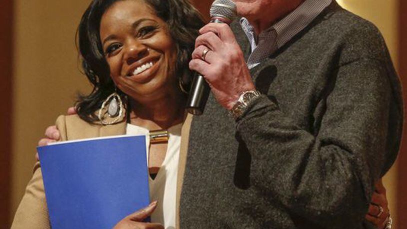 Democratic presidential candidate Bernie Sanders hugs Kishia Saffold of Dothan, Ala., after she told a personal story during a forum at First Christian Church on Jan. 9 in Des Moines.