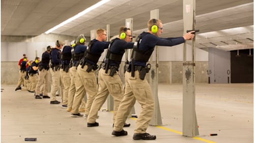 Gwinnett County Police Department recruits train with firearms.