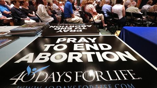 More than 200 anti-abortion activists listen to keynote speaker Shawn Carney, the creator of 40 Days For Life, during a kickoff program in September for a 40-day vigil at St. Joseph Catholic Church in Marietta. Curtis Compton/ccompton@ajc.com