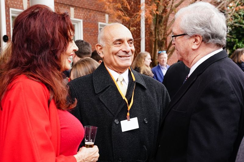 Charles de Caro and Lynne Russell speak with Tom Johnson, the former President of CNN, at a ceremony dedicating an AT&T WarnerMedia building to Ted Turner, the founder of Turner Broadcasting System, on Friday, December 6, 2019, in Atlanta. 