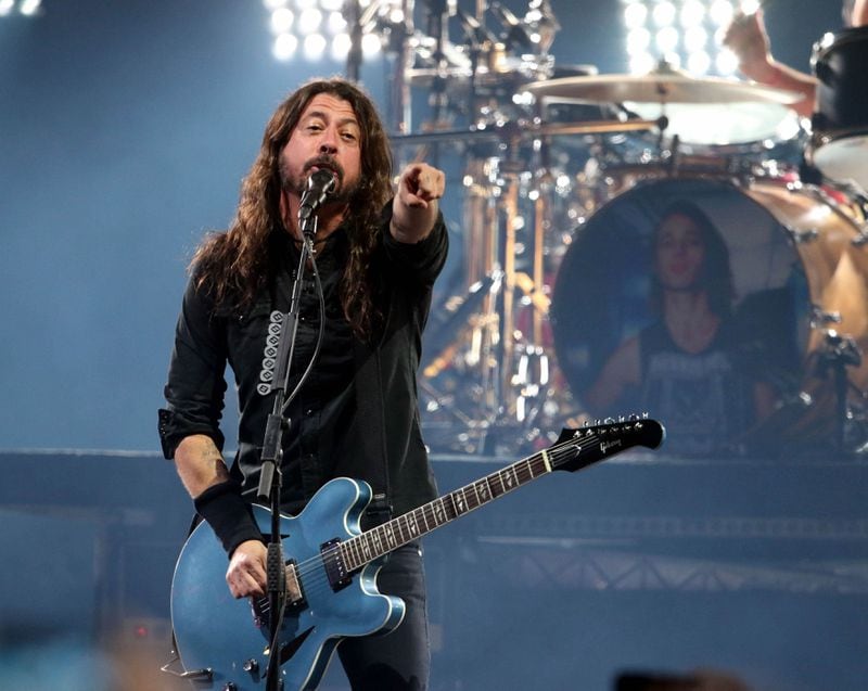 Foo Fighters frontman Dave Grohl was drenched in sweat early in their Super Saturday Night show sponsored by DirecTV.