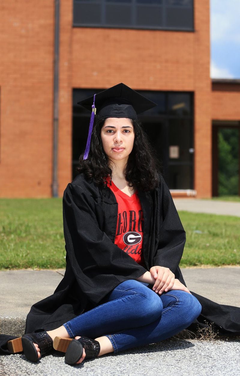 Yara Manasrah poses for a portrait on Sunday, June 14, 2020, at Chapel Hill High School in Douglasville, Georgia. Thousands of K-12 schools and colleges closed in the middle of the spring semester this year due to the coronavirus pandemic. For high school and college seniors, the closure not only meant the end of in-person classes, but also no traditional senior rituals like prom and graduation. 