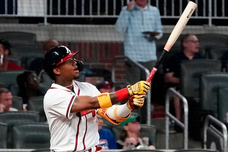 Atlanta Braves' Ronald Acuna Jr. watches his solo home run during the fifth inning of the team's baseball game against the Chicago Cubs on Tuesday, April 27, 2021, in Atlanta. (AP Photo/John Bazemore)