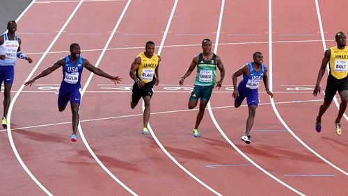 United States' Justin Gatlin, second left, celebrates as he wins the Men's 100 meters final during the World Athletics Championships in London Saturday, Aug. 5, 2017. United States' Christian Coleman, second right was second and Jamaica's Usain Bolt, right, was third. (AP Photo/Martin Meissner)