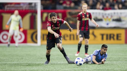 Atlanta United defender Michael Parkhurst (3) goes for the ball during the match between NYC FC and Atlanta United at Mercedes-Benz Stadium in Atlanta, Georgia, on Sunday, April 15, 2018. (REANN HUBER/REANN.HUBER@AJC.COM)