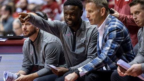 Alabama assistant coach Antoine Pettway talks with Alabama head coach Nate Oats during the second half of an NCAA college basketball game against Longwood, Monday, Nov. 7, 2022, in Tuscaloosa, Ala. (AP Photo/Vasha Hunt)