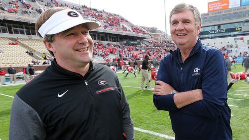 Georgia coach Kirby Smart and Georgia Tech coach Paul Johnson share a laugh on the field before the two teams face off in their game Saturday, November 25, 2017, in Atlanta. Curtis Compton/ccompton@ajc.com