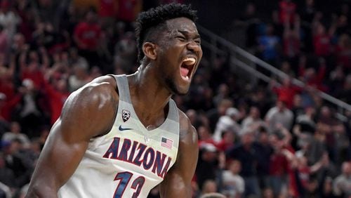 LAS VEGAS, NV - MARCH 10:  Deandre Ayton #13 of the Arizona Wildcats reacts after dunking against the USC Trojans during the championship game of the Pac-12 basketball tournament at T-Mobile Arena on March 10, 2018 in Las Vegas, Nevada. The Wildcats won 75-61.  (Photo by Ethan Miller/Getty Images)