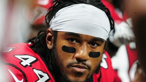 Vic Beasley of the Falcons sits on the sideline during the first half against the Packers Sunday in Atlanta's Mercedes-Benz Stadium.