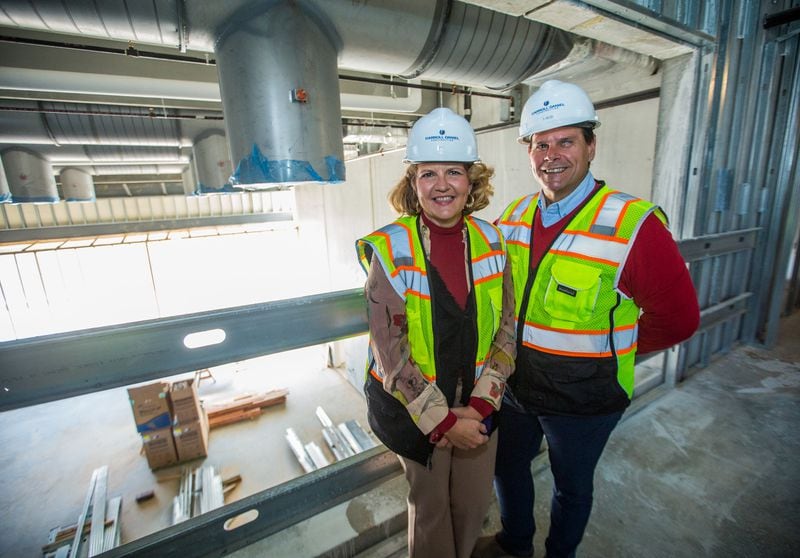 Aurora Theatre co-founders Ann-Carol Pence and Anthony Rodriguez tour the Lawrenceville Performing Arts Center, which is expected to open this summer. 
Jenni Girtman for The Atlanta Journal-Constitution