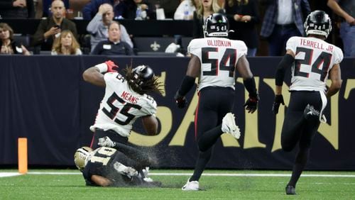 Atlanta Falcons linebacker Steven Means (55) is tackled by New Orleans Saints wide receiver Tre'Quan Smith (10) after a fumble during the second half of an NFL football game, Sunday, Nov. 7, 2021, in New Orleans. (AP Photo/Derick Hingle)