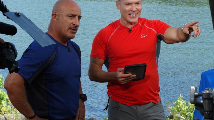 Sam Champion (right) with Jim Cantore when he worked at AMHQ last June. CREDIT: Rodney Ho/rho@ajc.com