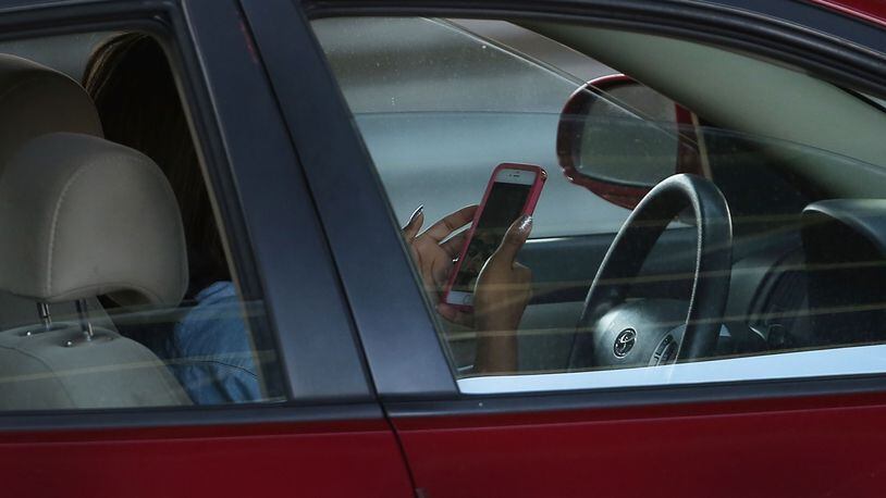 FILE PHOTO:  A new study suggests that many drivers think that it is safe to use their cell phones while driving.