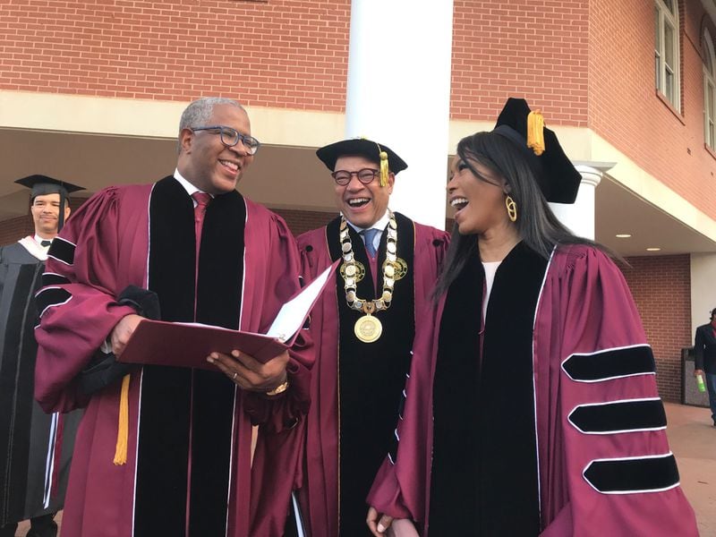 Tech billionaire Robert F. Smith (from left), Morehouse College President David Thomas and actress Angela Bassett prepare to walk to the graduation ceremonies at the college on Sunday, May 19, 2019.  Smith and Bassett were to receive honorary degrees. (Photo: Bo Emerson/AJC)