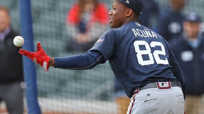 Ronald Acuna preparing for Tuesday night’s exhibition game between Braves prospects and the major league team at SunTrust Park. (Curtis Compton/ccompton@ajc.com)