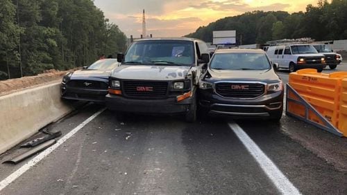 Sandy Springs police recently posted this photo of a three-vehicle-squeeze at the Glenridge Drive exit off I-285. The SUV on the right made an ill-fated, last-minute decision to exit, causing a chain-reaction wreck. No one was hurt. (Credit: Sandy Springs Police Department)