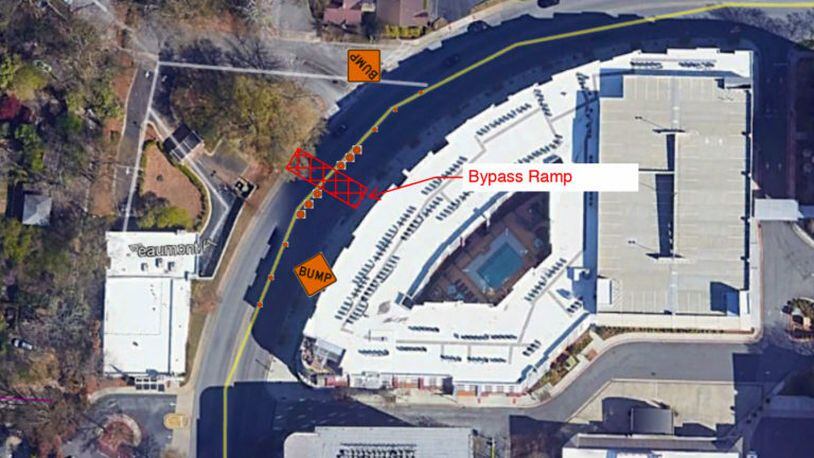 This temporary bypass on Commerce Drive at Beaumont Place will stay active only through this week as DeKalb County commences sanitary sewer improvements adjacent to Decatur’s On The Square apartments (white roof). Courtesy City of Decatur